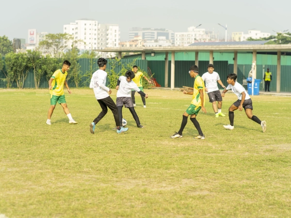 Students from AKA Dhaka playing football during the Inter-School Football Tournament 2024–2025.