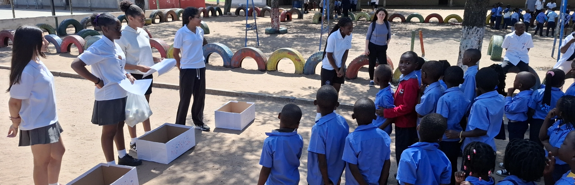 AKA Maputo students teaching and engaging with public school learners.