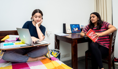 Two dorm students engaged in a discussion in the dorms.