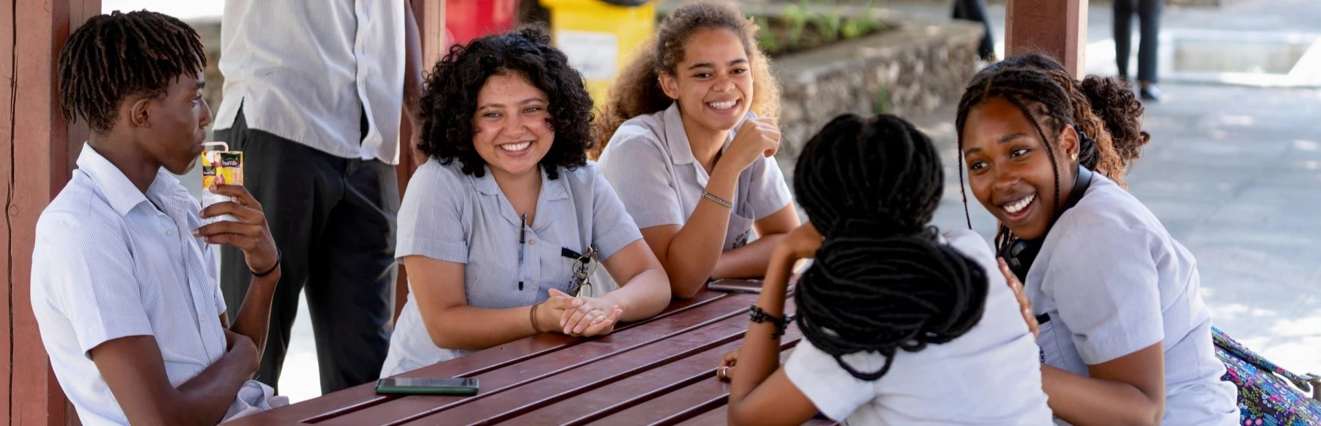 Students sitting together in the gazebos.