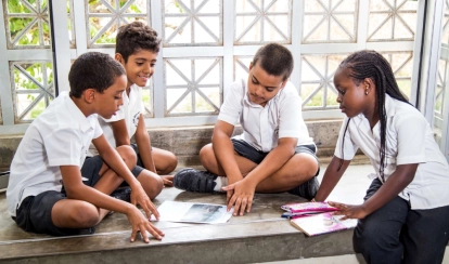 Junior School students collaborating on a group project