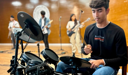 Students learn how to play different musical instruments and perform them on stage in events.